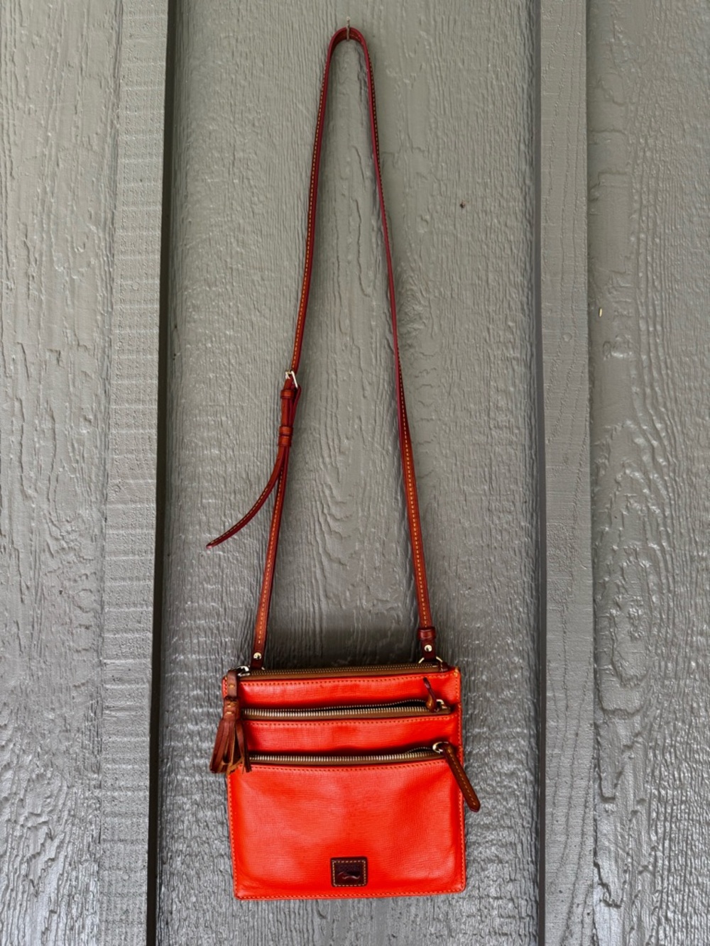 Dooney & Bourke Orange-Red Leather Triple Zip Crossbody